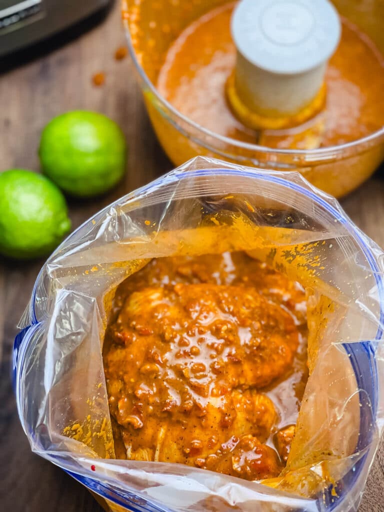 chicken in a plastic bag with asado marinade