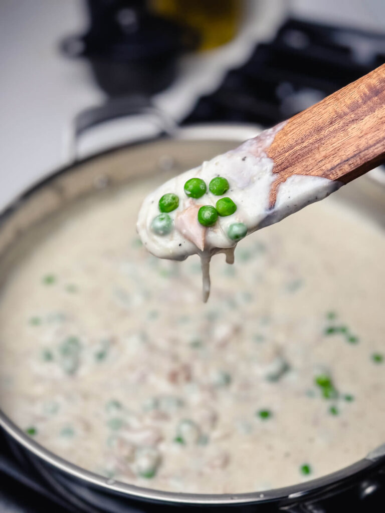 peas on a spoon of creamed tuna