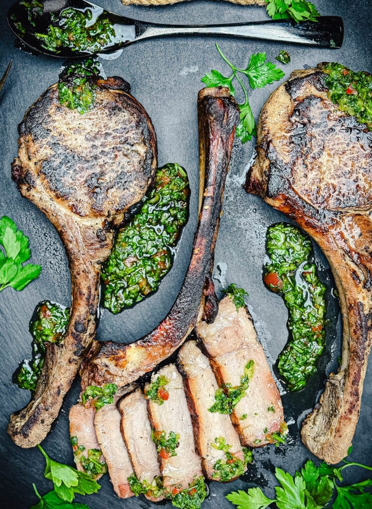 sliced pork chops on a cutting board