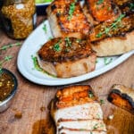 mustard glazed pork chops on a white platter