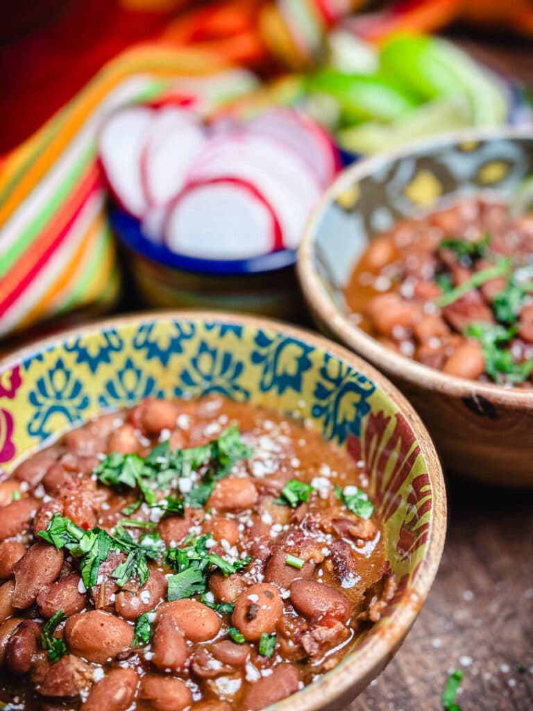 close up shot of a bowl of borracho beans