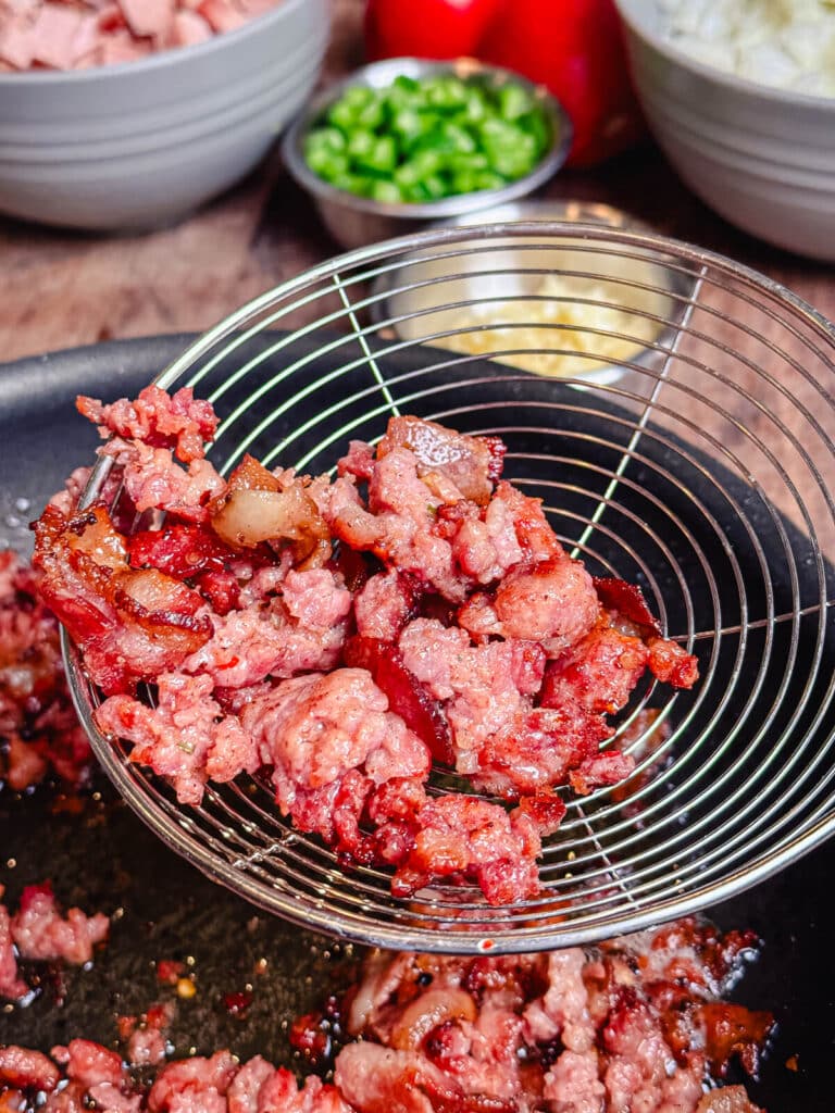 cooked chorizo in a spoon