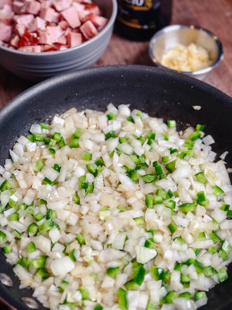 onion and garlic cooked down in a pan