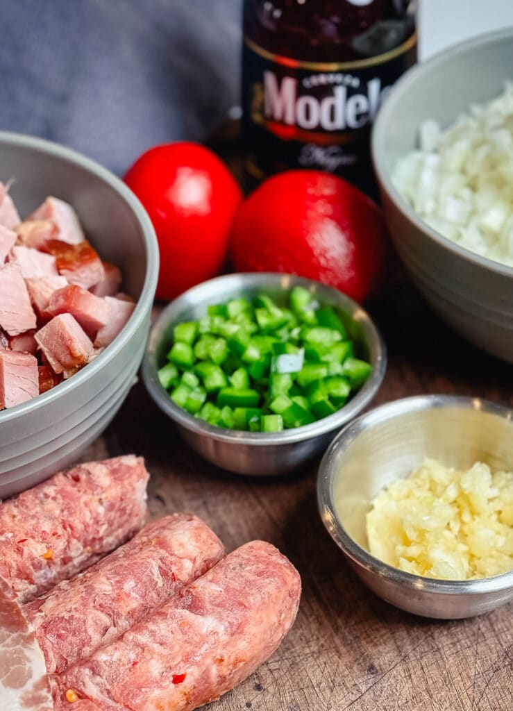chorizo, hame, and veggies for borracho beans on a platter