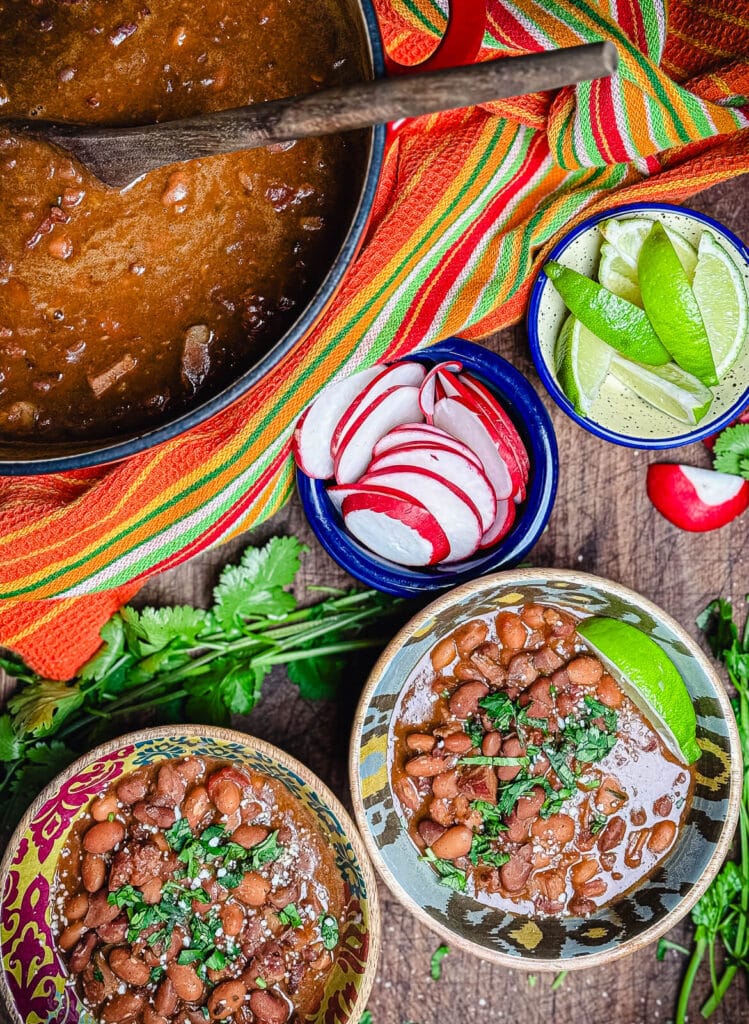 overhead shot of two bowls of borracho beans
