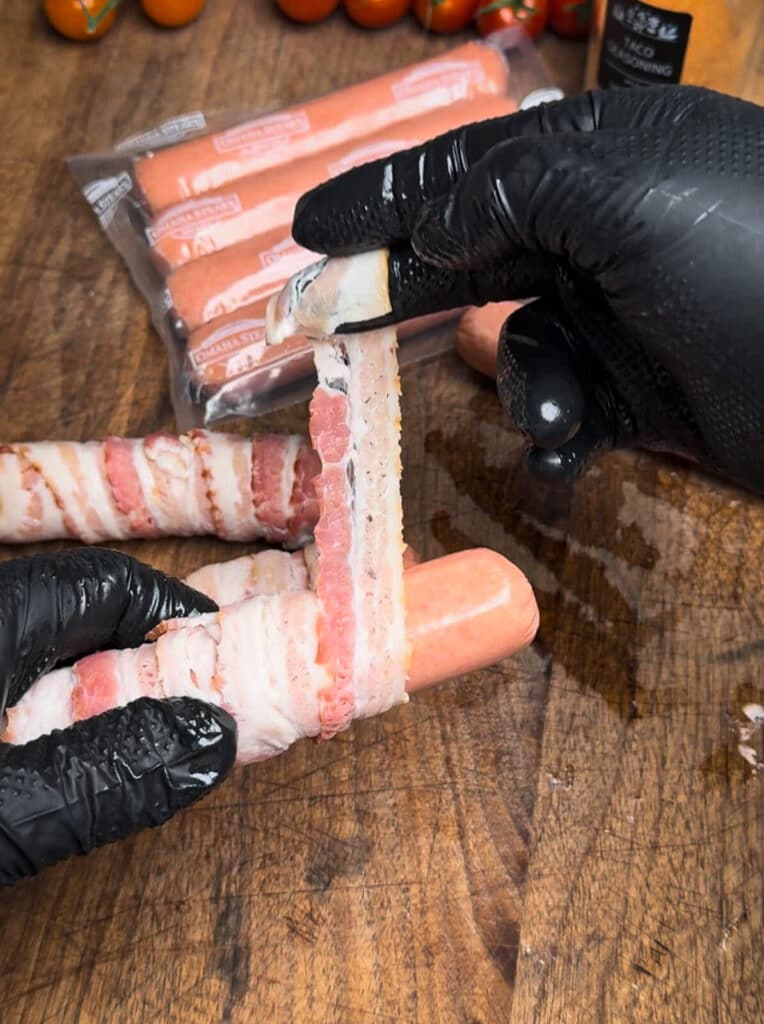 bacon wrapping a hot dog