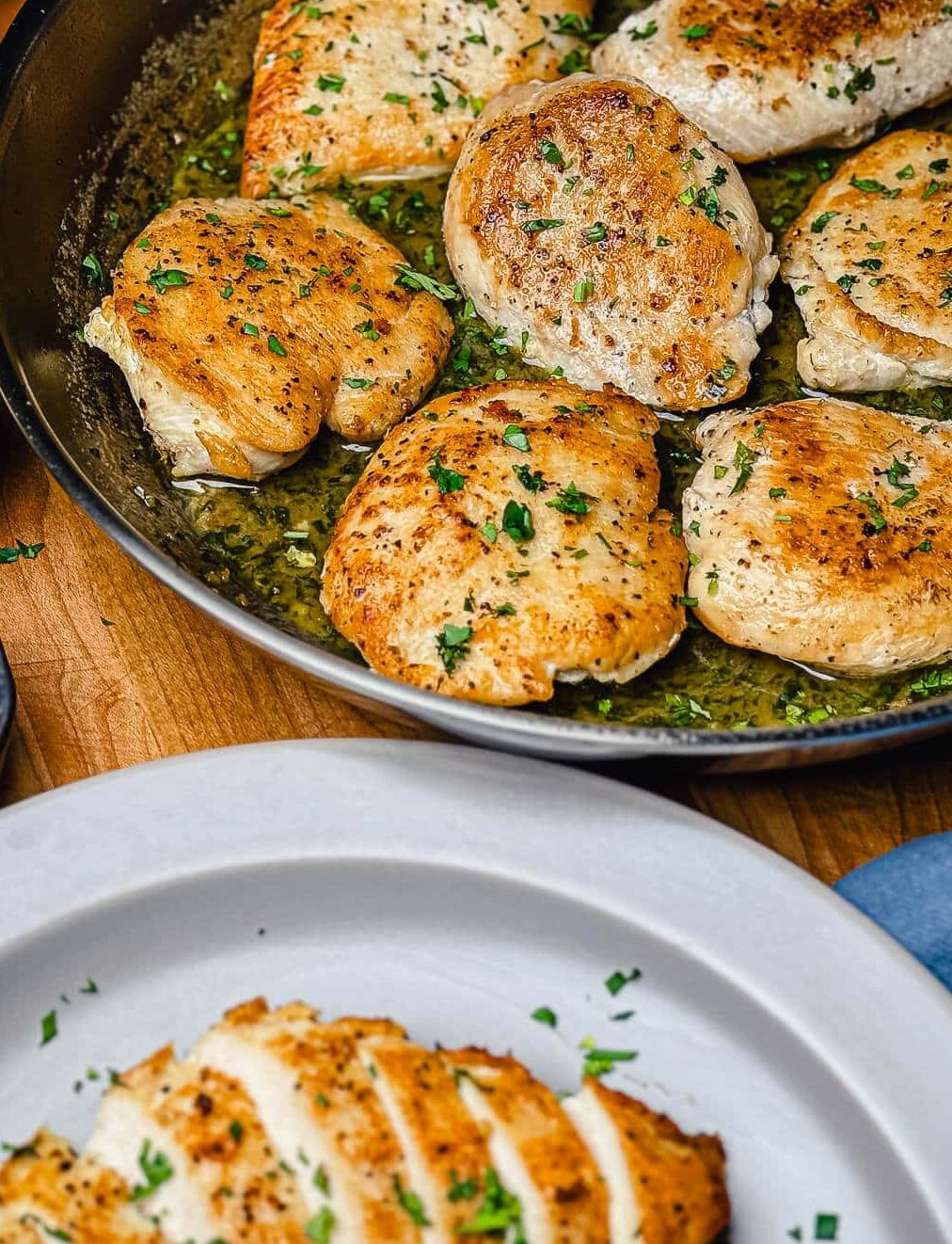 stainless steel pan with chicken breasts