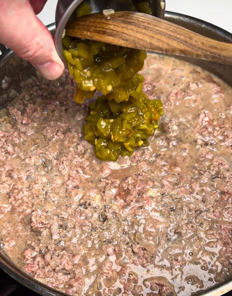 green chilis being added to taco chili