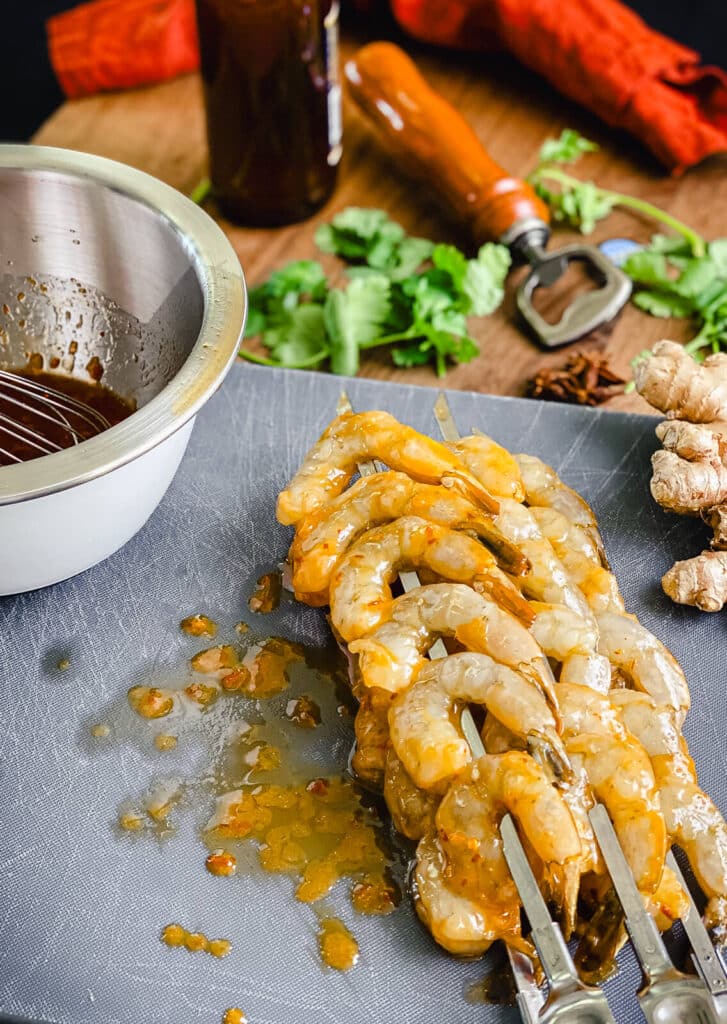 raw shrimp, glazed with sweet chili sauce, on skewers