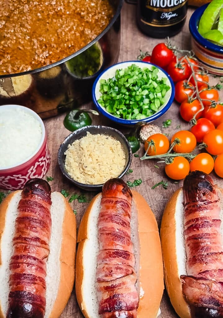 bacon wrapped hot dogs on a bun