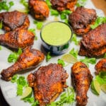 platter of peruvian grilled chicken with green sauce