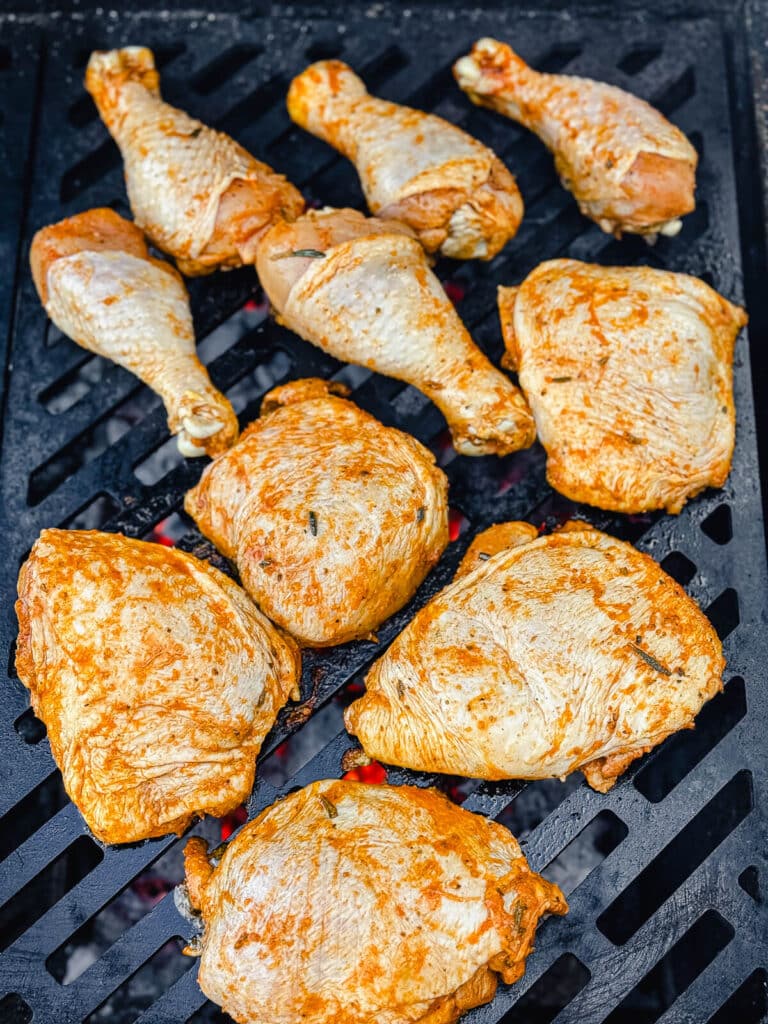 chicken on a grill over hot coals