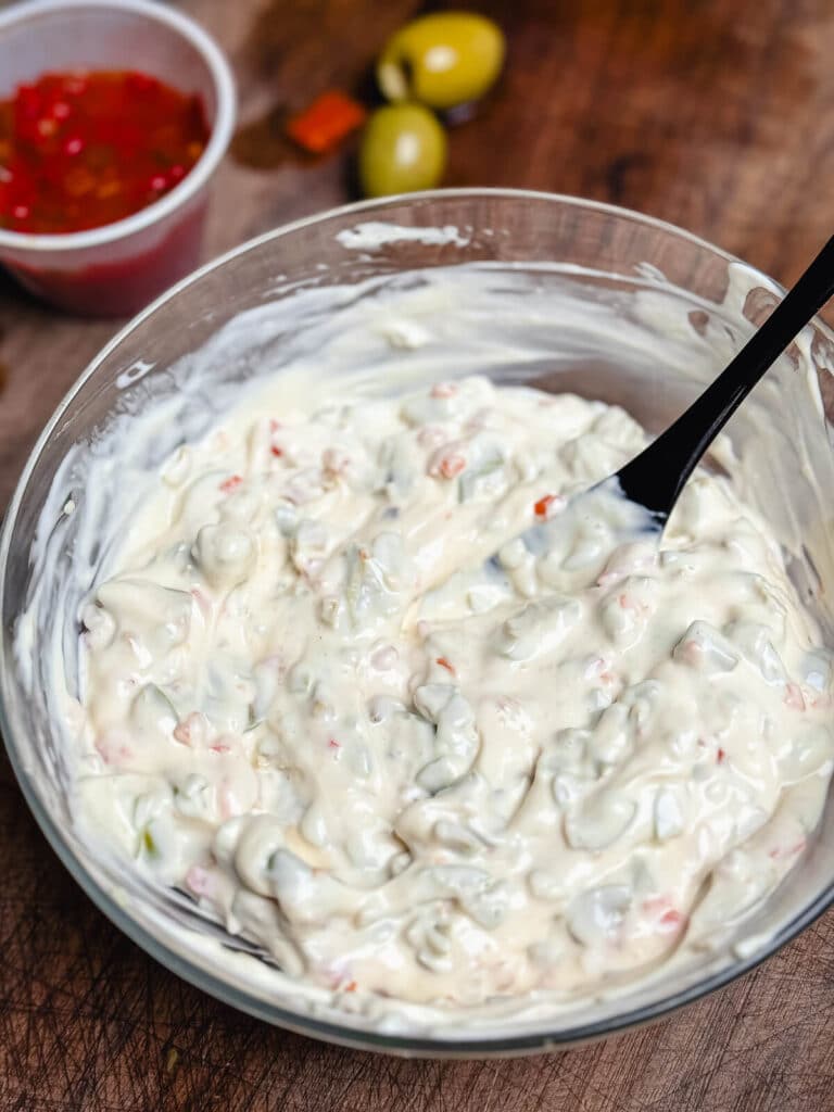 Michigan olive burger spread in a glass bowl with a black spoon