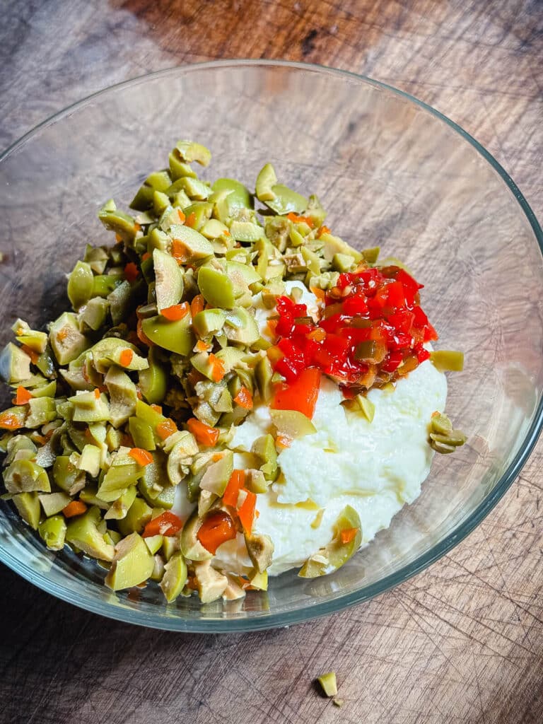 ingredients for olive spread in a bowl