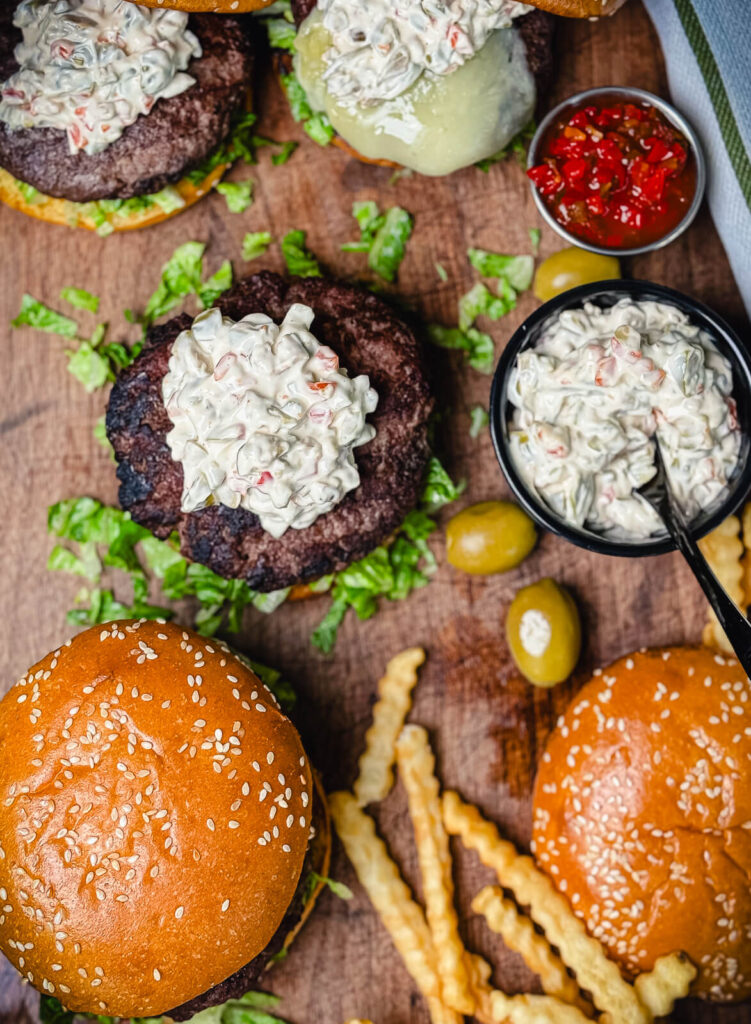 Michigan olive burgers on a platter with french fries