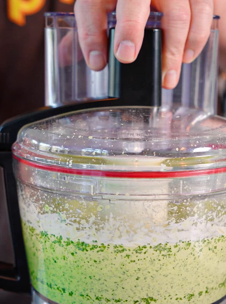 Aji verde sauce bing mixed in a food processor