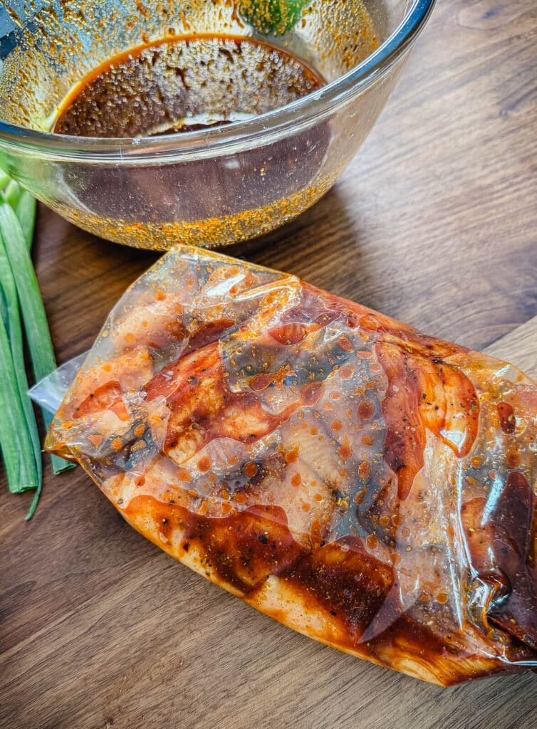 Peruvian chicken marinating in a a plastic bag