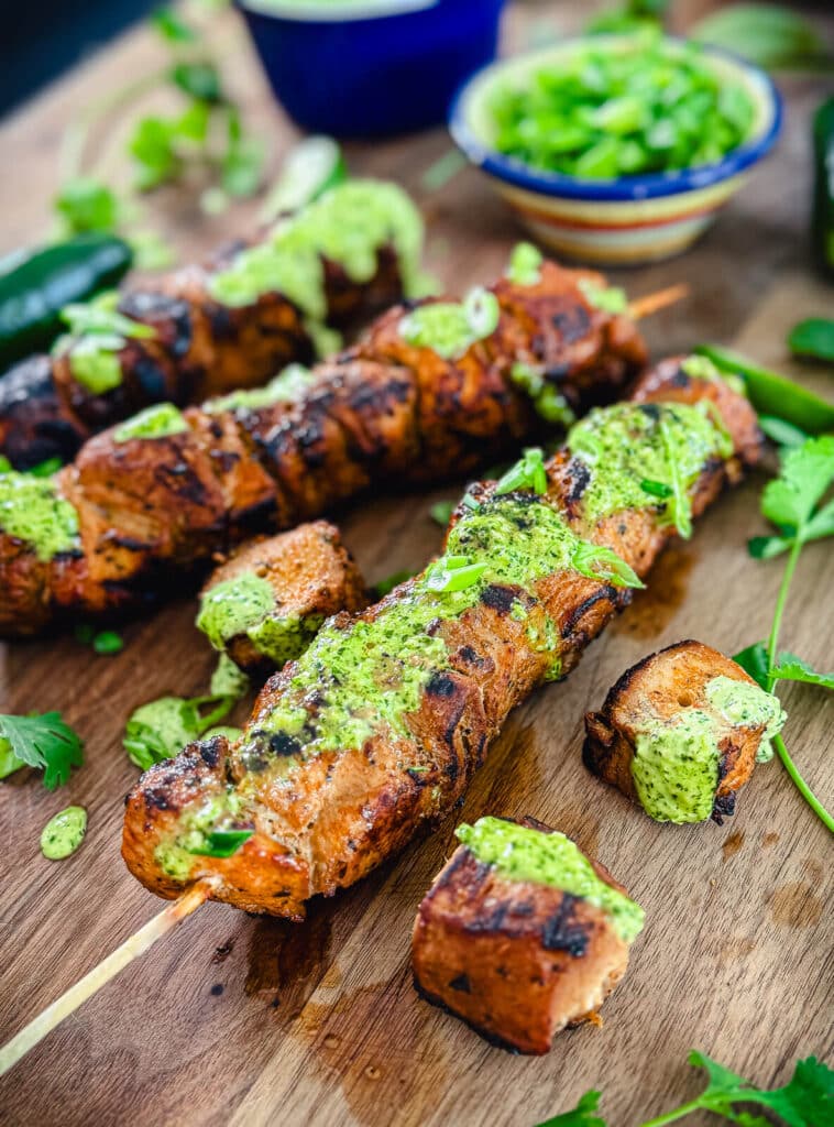 Peruvian chicken skewers made with breast meat with green sauce