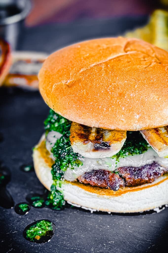 chimichurri dripping from a columbian burger