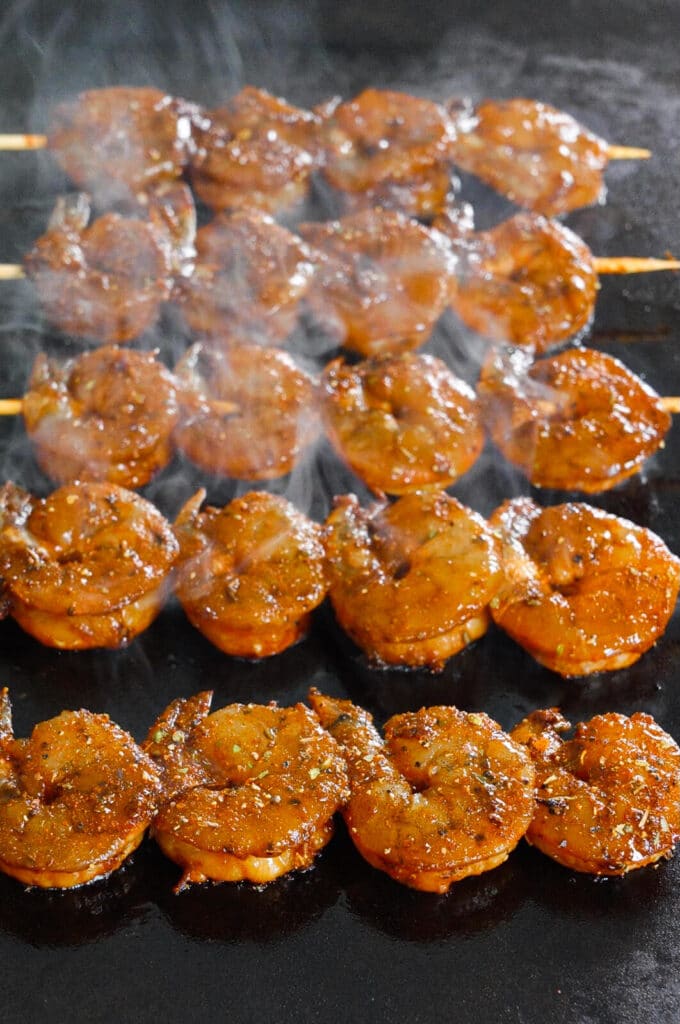 shrimp searing on a carbon steel griddle