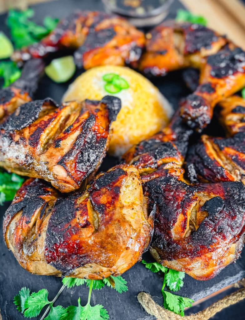 chicken Inasal on a cutting board with rice