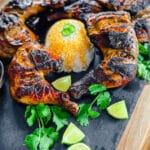 chicken Inasal with limes on a platter