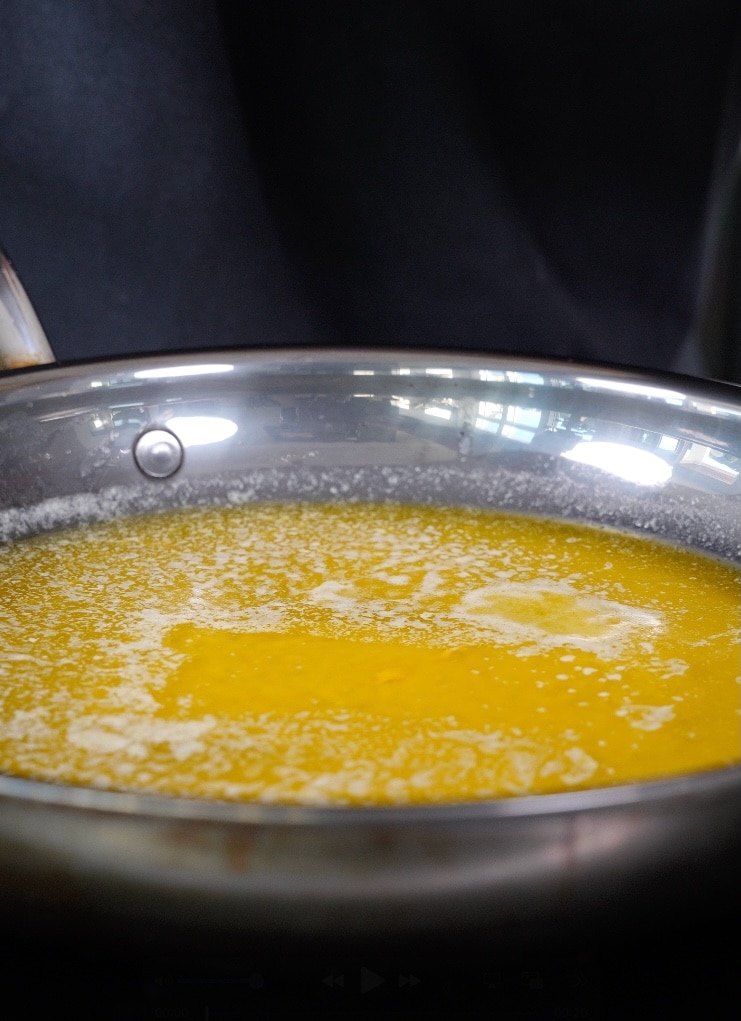 melted butter for chipotle cowboy butter in a stainless skillet