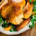 smoked turkey on a platter for a recipe titled How To Smoke A Turkey