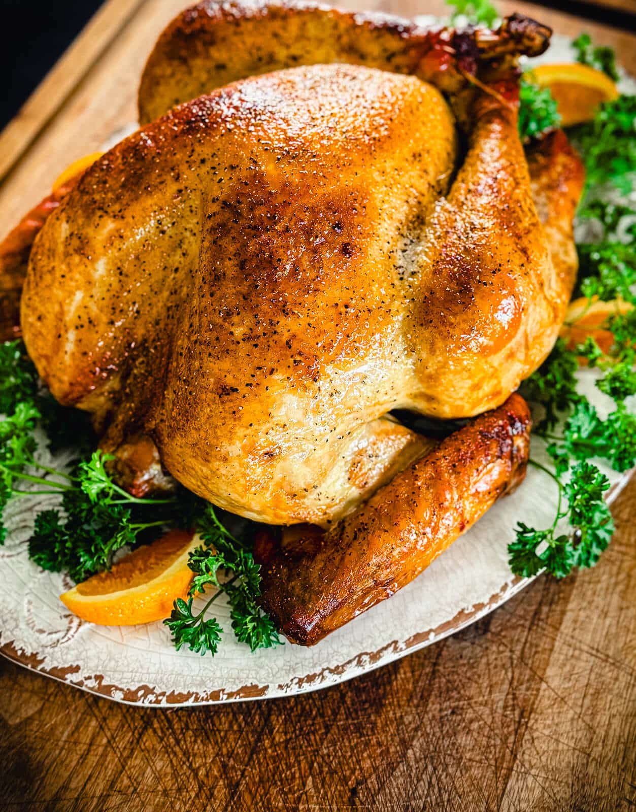 smoked turkey on a platter for a recipe titled How To Smoke A Turkey