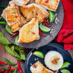 pan seared red snapper on a plate with prik nam pla