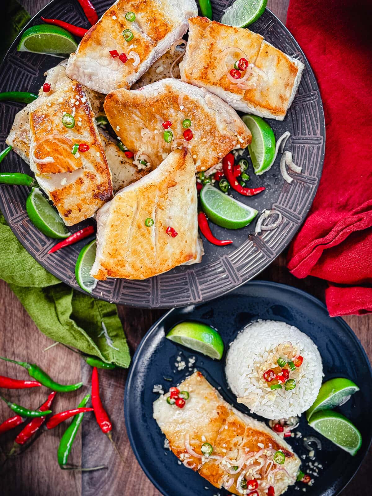 pan seared red snapper on a plate with prik nam pla