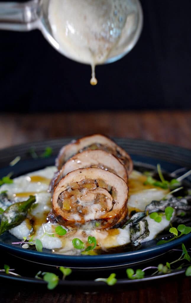 brown butter being added to a stuffed pork tenderloin