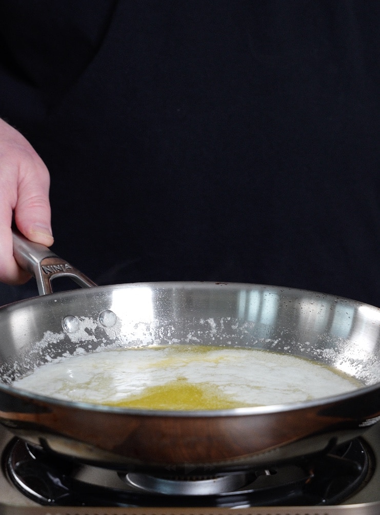 melted butter in a skillet on a burner