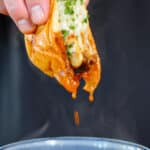 birra smashburger being dipped into consomme