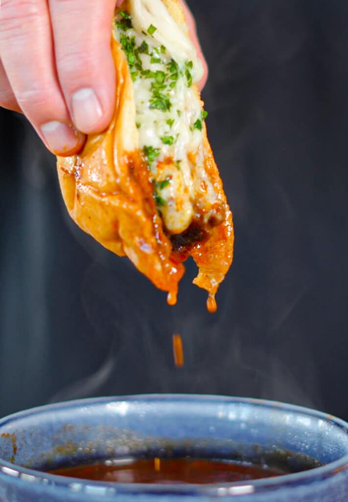 birra smashburger being dipped into consomme