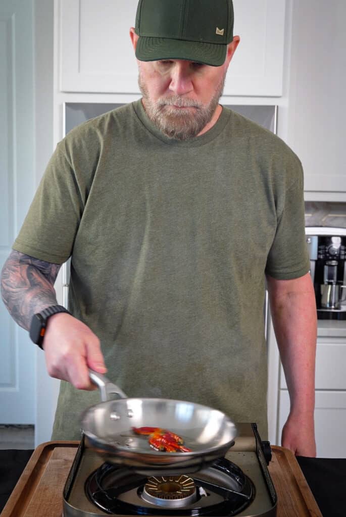 red chili peppers being warmed in a pan