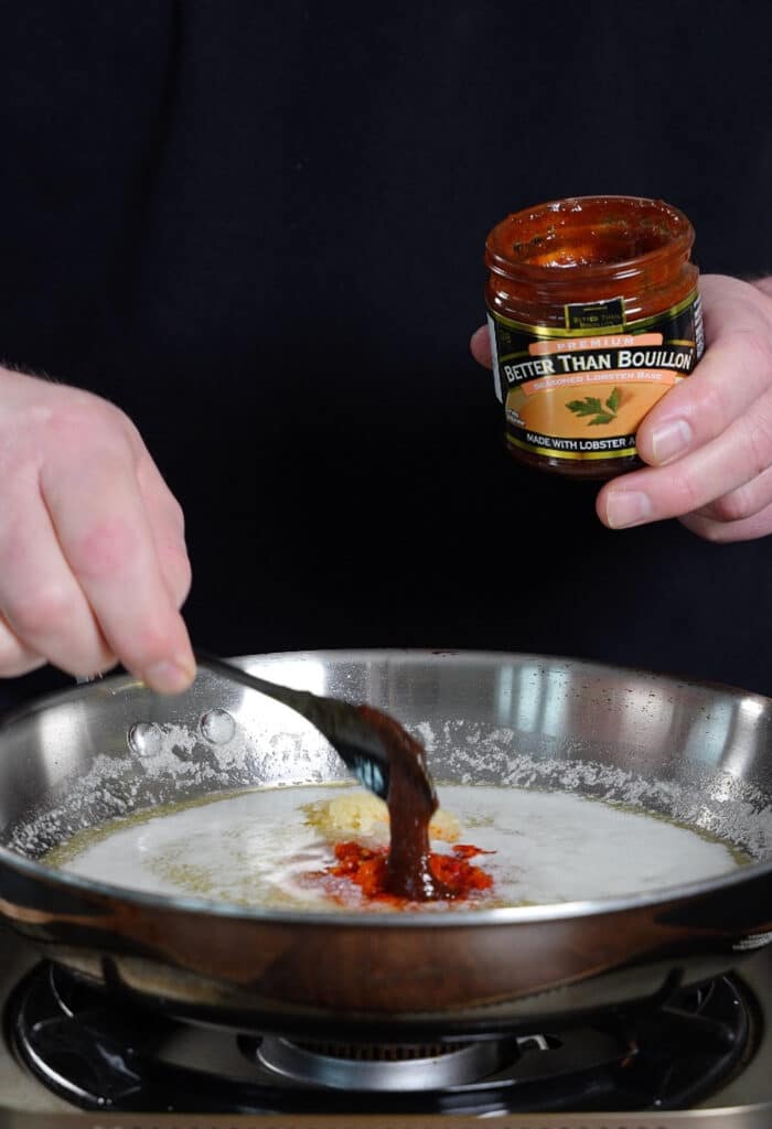 lobster base being added to calabrian chili butter