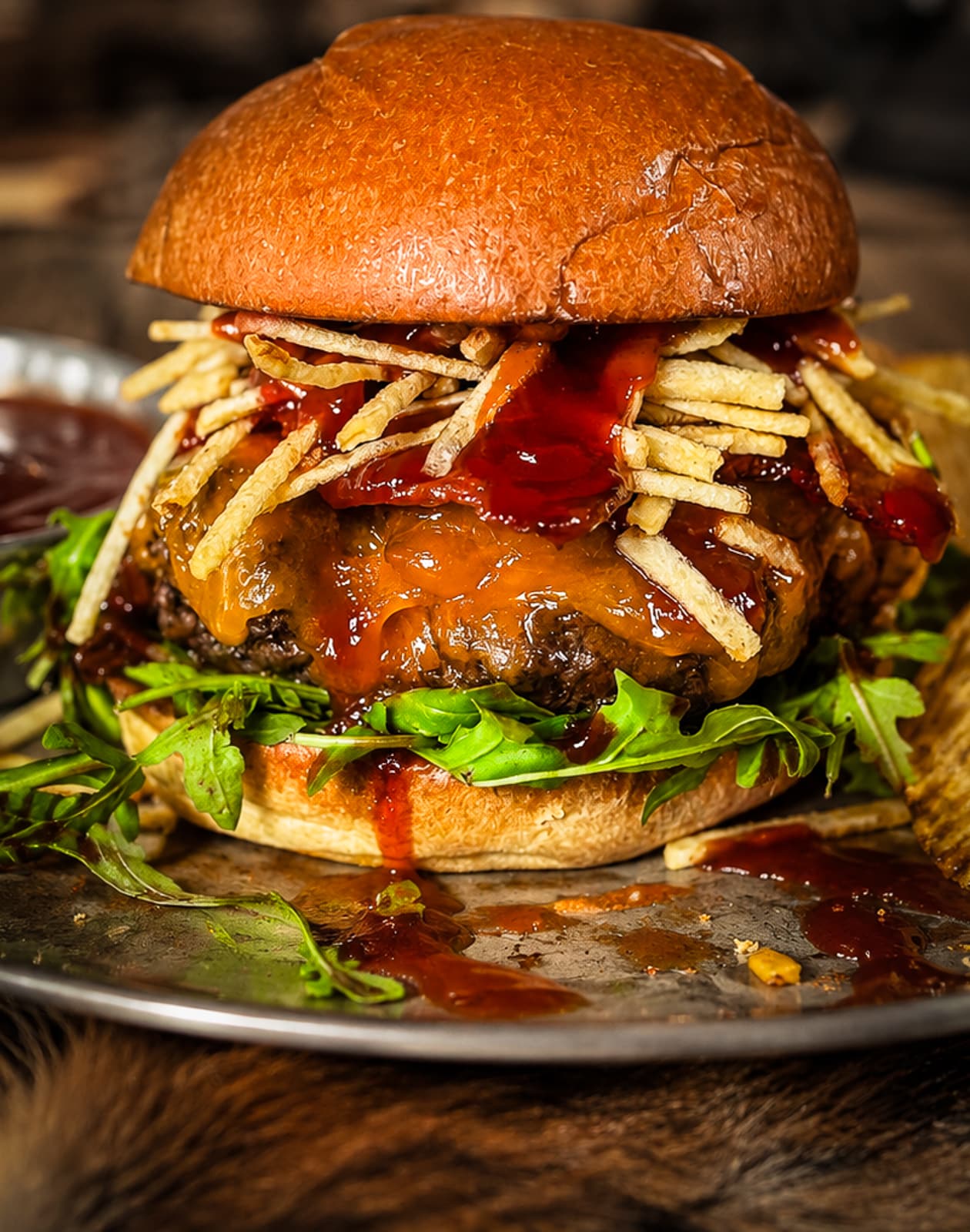 bbq venison cheese burger with shoe string potatoes