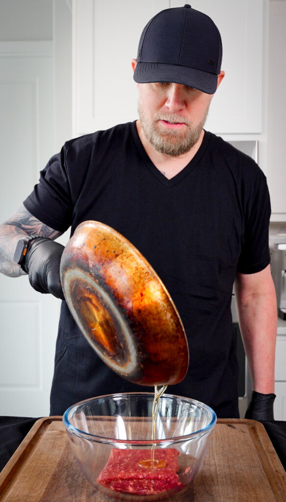 rendered bacon fat being added to ground venison