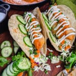 tikka masala tacos with cucumbers and slaw