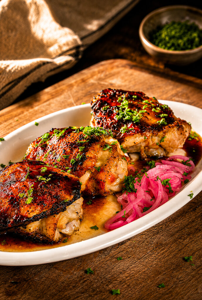 grilled hot honey chicken thighs on a plate